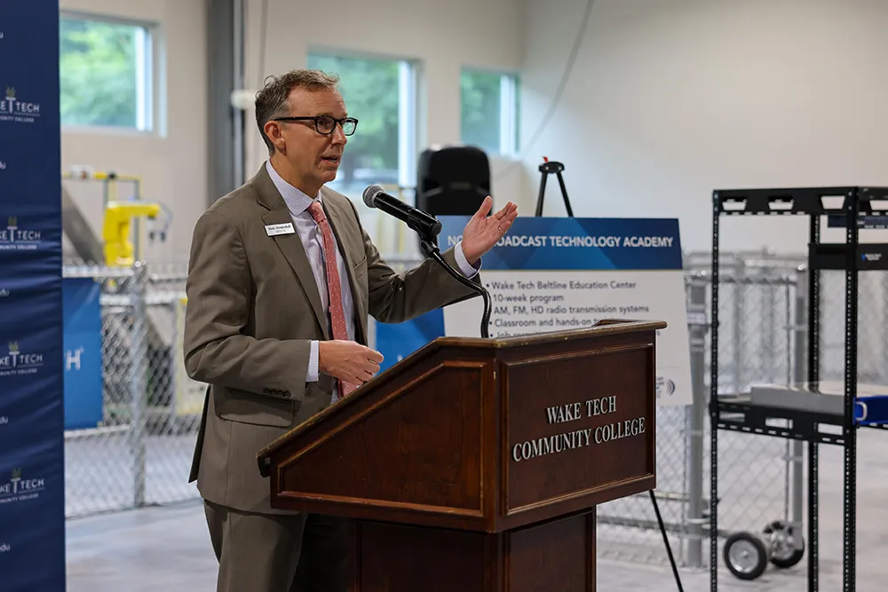North Carolina Association of Broadcasters President Mark Mendenhall speaks at the ceremony announcing the NCAB Broadcast Technology Academy to train radio engineers at the college.