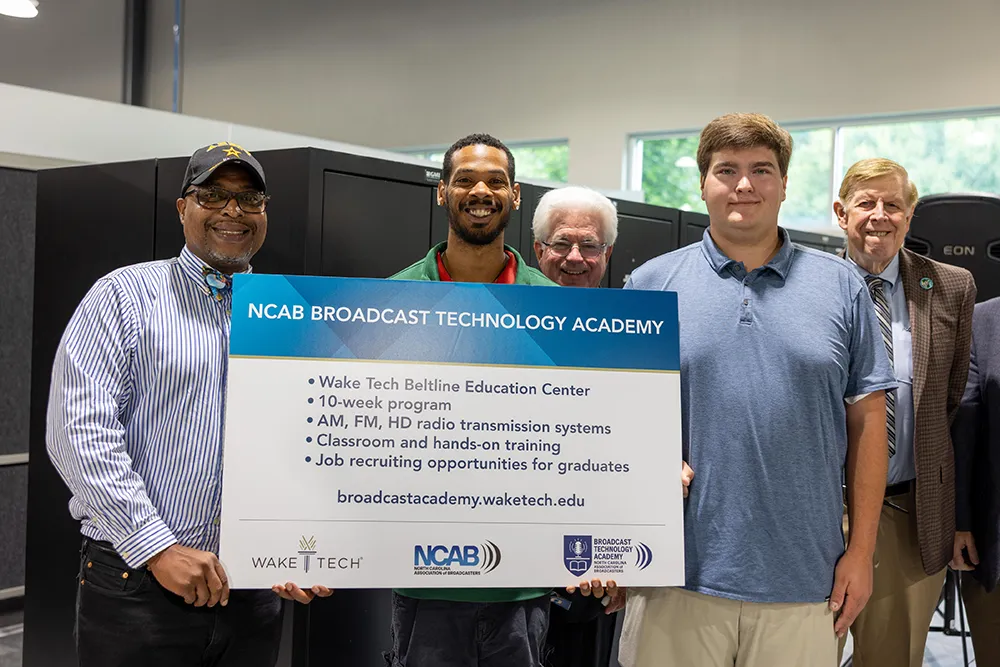 Wake Tech and North Carolina Association of Broadcasters officials pose for a photo after announcing the NCAB Broadcast Technology Academy to train radio engineers at the college.