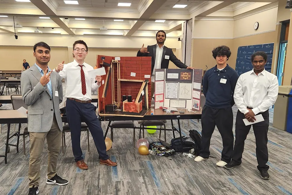 Forgotten Five tied for fourth place in the Rube Goldberg Machine Competition.