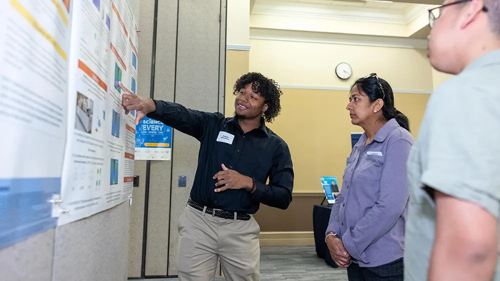 Students in the START program show off findings from a semester of scientific research.