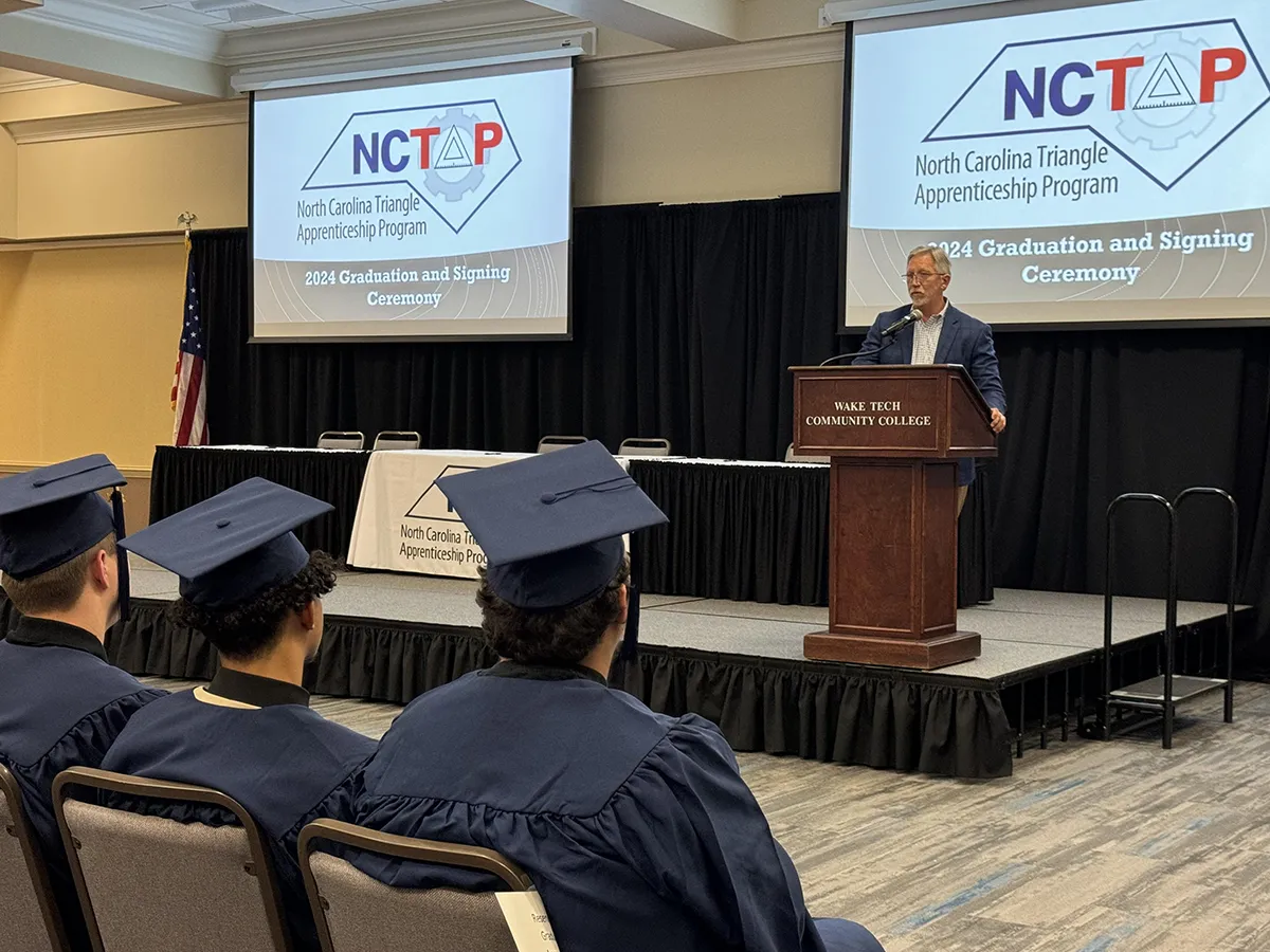 Wake Tech President Dr. Scott Ralls speaks to apprentices at the NCTAP ceremony.