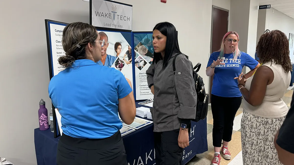 Wake Tech staff and students provide information about the college's programs and services to Spanish-speaking adults during the Open House en Español.