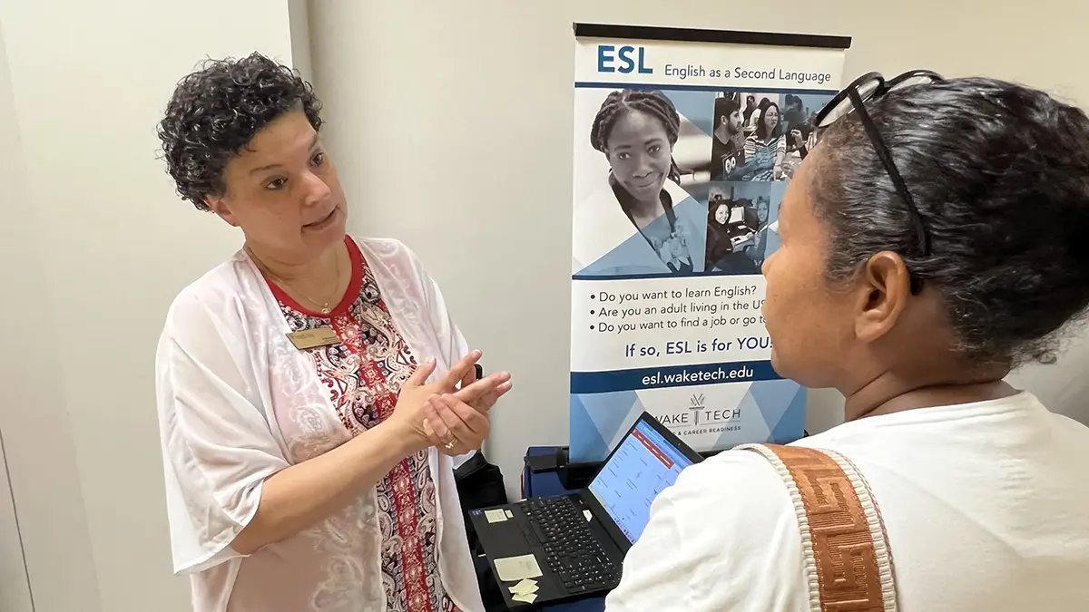 Wake Tech staff and students provide information about the college's programs and services to Spanish-speaking adults during the Open House en Español.