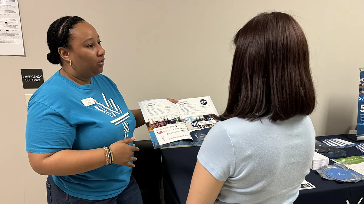 Wake Tech staff and students provide information about the college's programs and services to Spanish-speaking adults during the Open House en Español.