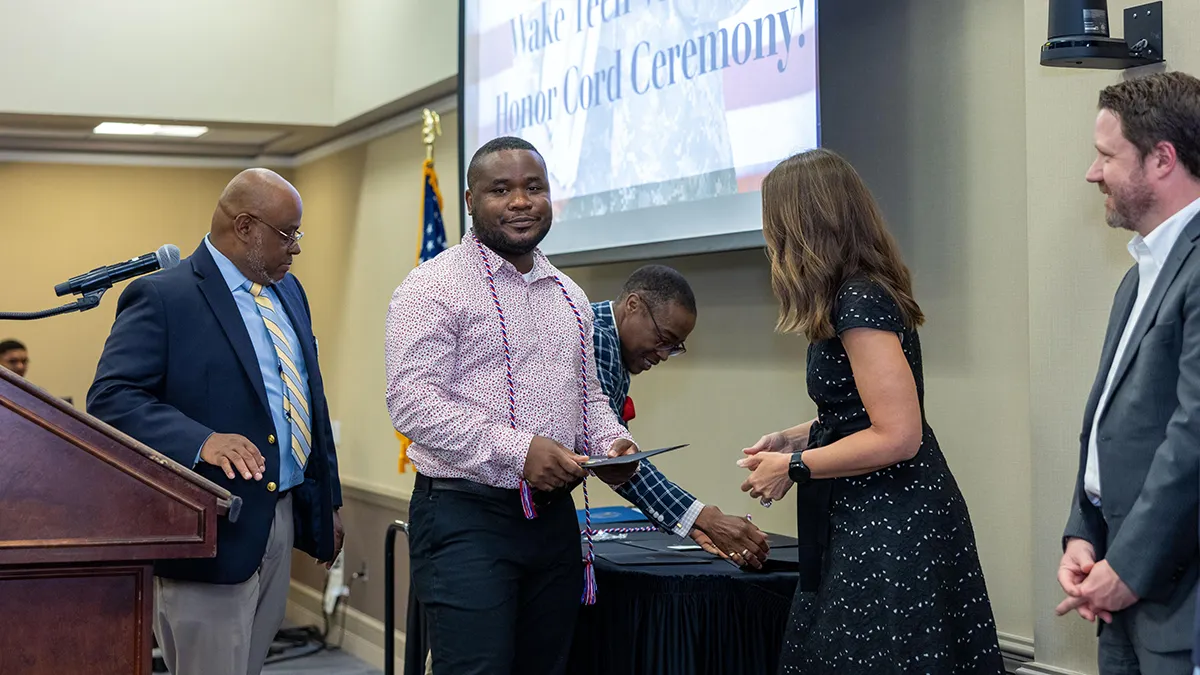 Student veterans received honor cords that they can wear at graduation.