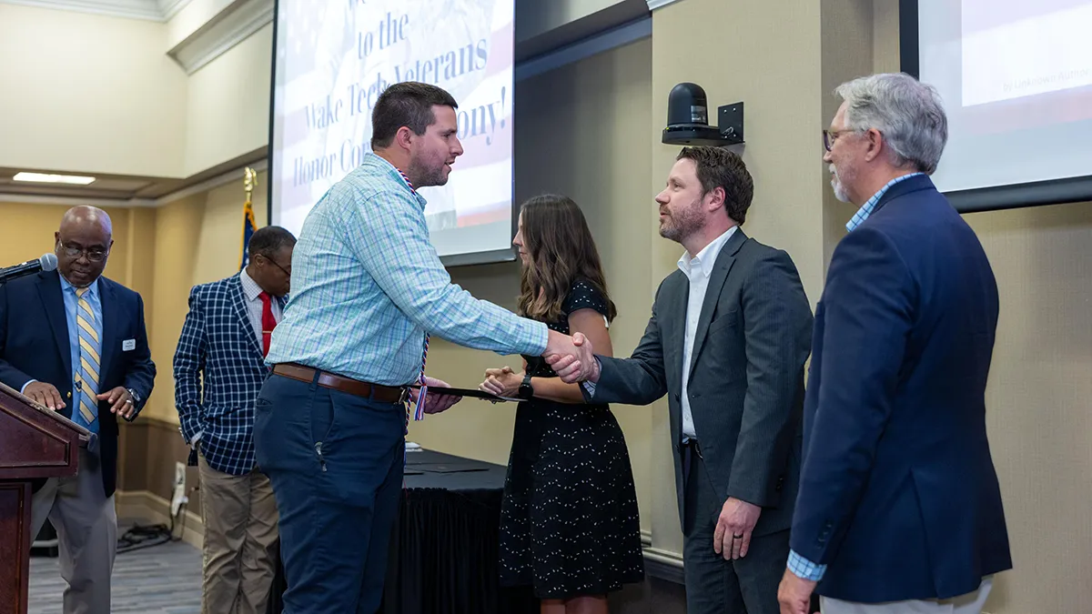 Student veterans received honor cords that they can wear at graduation.