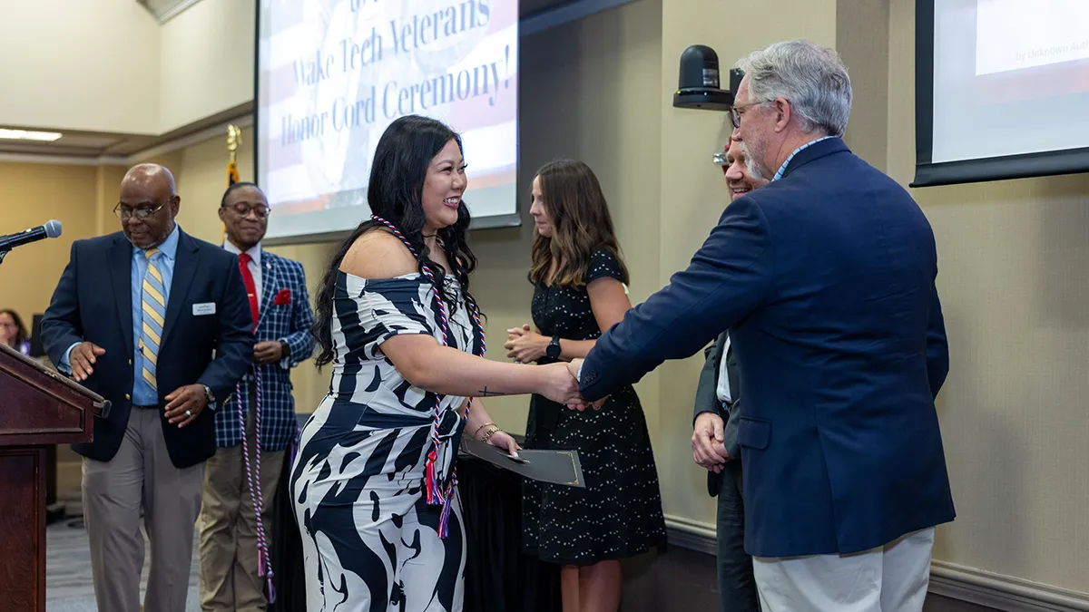 Student veterans received honor cords that they can wear at graduation.