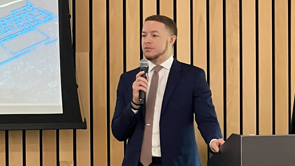 Anthony Lucas, head of Wake Tech's Cybersecurity program, speaks at a ceremony honoring the first cohort of students to complete the Sentinel Cybersecurity Bootcamp.