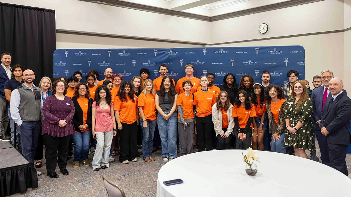 Dozens of Wake Tech students in the Boost program pose for a photo with college administrators and staff following a kickoff luncheon.