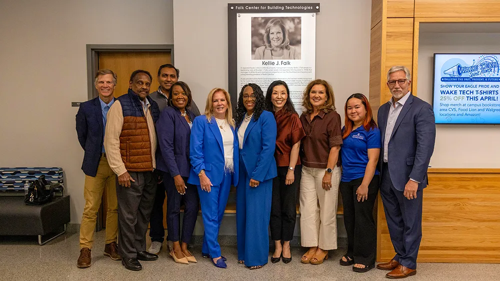 Kellie J. Falk poses for a photo with Wake Tech trustees