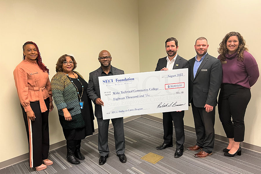 From left to right: Joy Curry, Director, WCE Financial Resources and Student Support, Lonette Mims, Dean, Occupational Services and Western Wake Chief Campus Officer, Anthony Caison, Vice President, Workforce Continuing Education, Chad Gibson, SECU Senior Vice President, Chris Woodward, SECU Vice President, Becca Mulvaney, SECU Foundation Program Officer