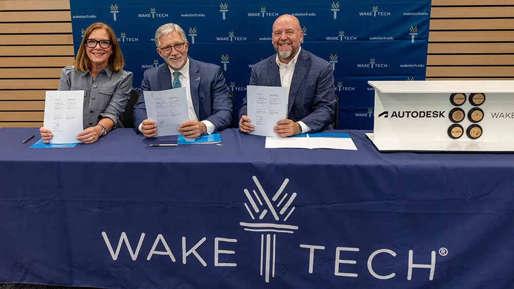 Wake Tech President Dr. Scott Ralls, center, joins representatives from Autodesk to sign a partnership agreement expanding advanced manufacturing and design technology training opportunities for students.