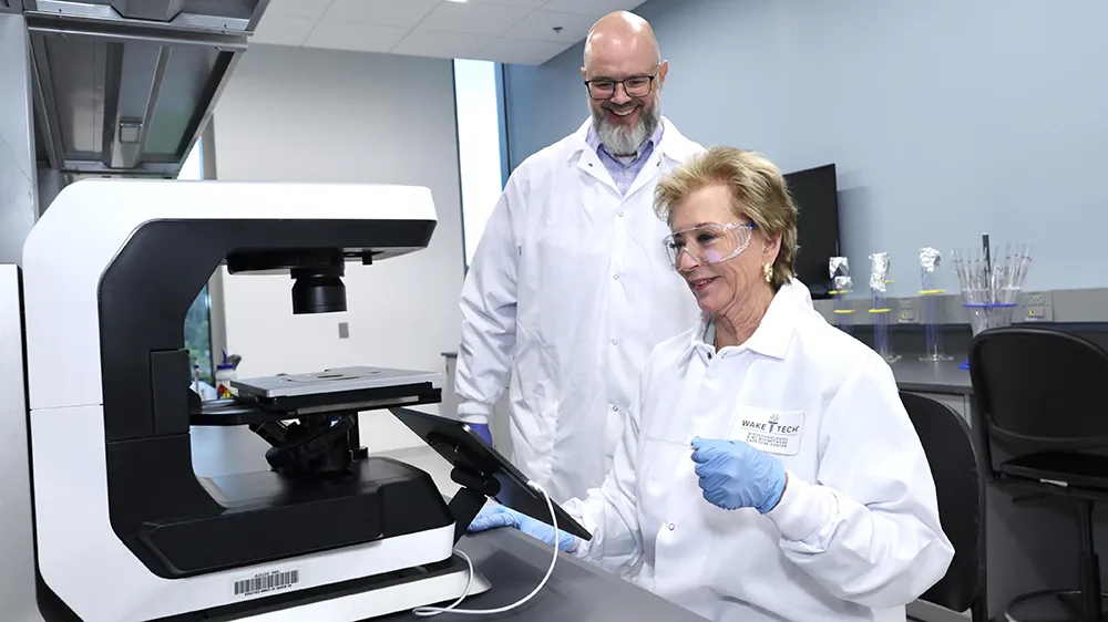 U.S. Education Secretary Linda McMahon checks out a biotechnology lab during a June 25, 2025, visit to Wake Tech's RTP Campus.
