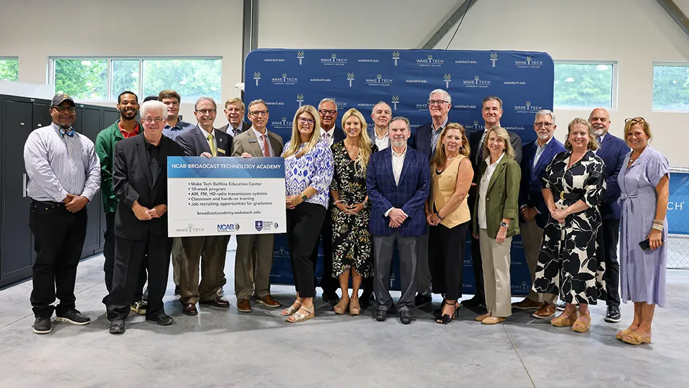 Wake Tech and North Carolina Association of Broadcasters officials pose for a photo after announcing the NCAB Broadcast Technology Academy to train radio engineers at the college.
