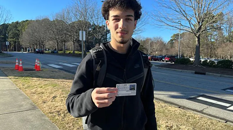 A Wake Tech student shows off his student ID.