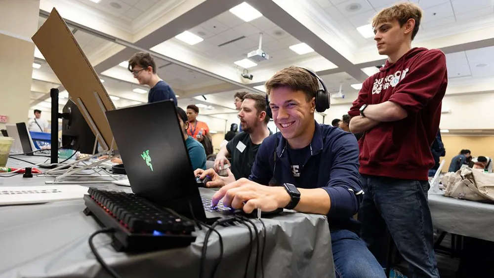 A Simulation and Game Development student shows off his skills at the Wake Tech Student Showcase.
