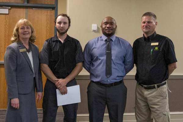 Dr. Gayle Greene, Wake Tech EVP; Casey Alvarez, Student; Pervis Williams, Student; Paige Kearns, Heavy Equipment & Transport Technology