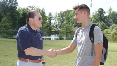 Dr Stephen C. Scott greets new students at the Northern Wake Campus