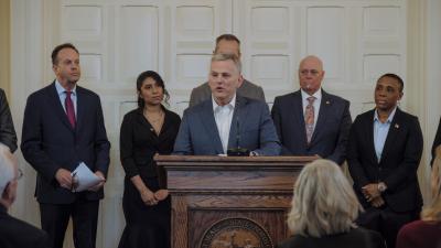 Wake Tech graduate Pilar Andrande-Rosalino standing in front of circuitry