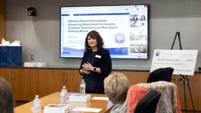 Amy MacDonald, executive director of Sponsored Programs, discusses the NSF grant at a Wake Tech board meeting.