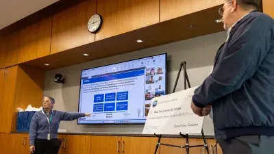 Amy MacDonald, executive director of Sponsored Programs, discusses the NSF grant at a Wake Tech board meeting.