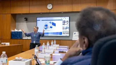 Amy MacDonald, executive director of Sponsored Programs, discusses the NSF grant at a Wake Tech board meeting.