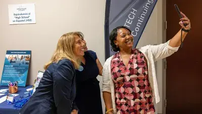 Wake Tech staff members take a selfie during the Open House en Español.