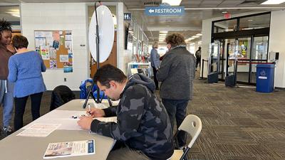 A Wake Tech student registers to vote