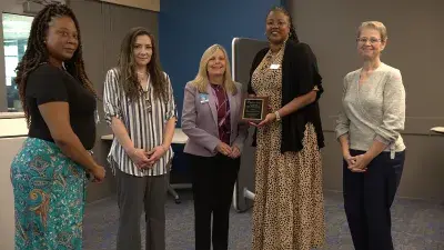 Wake Tech's 2024-25 Work-Based Learning Student of the Year George Dale poses for a photo with, left to right, IT Service & Support Assistant Professor Rebecca Sayers, Red Cross IT Service Desk Manager Debbie Walston and Kathy Frederick, director of Wake Tech's Work-Based Learning program.
