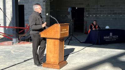 College Holds Topping-Out Ceremony for First Building at Future Campus