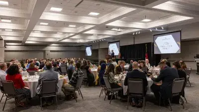 A table filled with trophies and plaques for Wake Tech Excellence Award winners
