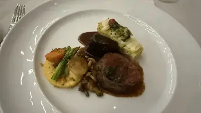 Members of Culinary Team USA prepare dishes for a fundraising dinner at Wake Tech that will help pay for expenses during the team's trip to Germany for the 2028 Culinary Olympics.