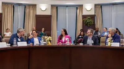 Judges listen to entrepreneurs pitch business ideas