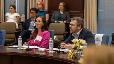 Judges listen to entrepreneurs pitch business ideas