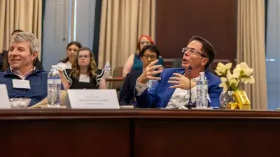 Judges listen to entrepreneurs pitch business ideas