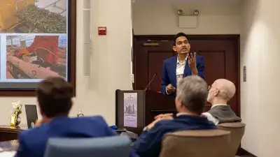 Judges listen to entrepreneurs pitch business ideas