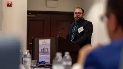 Judges listen to entrepreneurs pitch business ideas