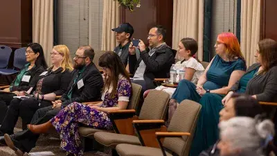 Judges listen to entrepreneurs pitch business ideas