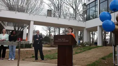 Image of students celebrating the reopening of Building C on the Southern Wake Campus, marking a major milestone in expanding innovative, STEM focused learning spaces for students.