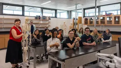 Image of students celebrating the reopening of Building C on the Southern Wake Campus, marking a major milestone in expanding innovative, STEM focused learning spaces for students.