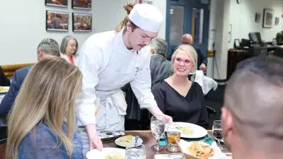 Chef Filippo Marini, right, created the menu for the "Ciao Down" fundraiser.