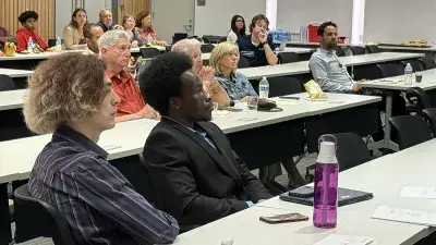 Wake Tech students and local business owners listen to a presentation during a cybersecurity workshop.