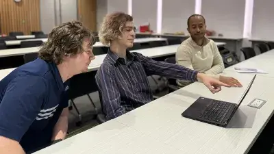 Wake Tech students and local business owners listen to a presentation during a cybersecurity workshop.