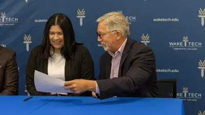 IT graduate Jennifer Medina & Wake Tech President Dr. Scott Ralls