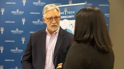 IT graduate Jennifer Medina & Wake Tech President Dr. Scott Ralls