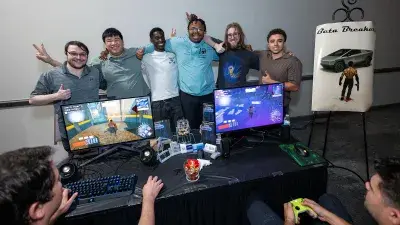 A man plays a video game created by Wake Tech students at the Simulation and Game Development annual Student Showcase.