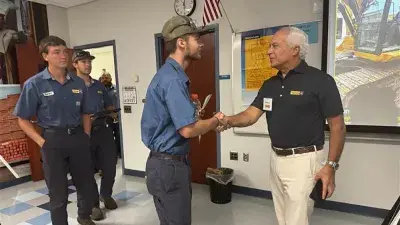 Gregory Poole apprentices gather with family and friends for a graduation ceremony.