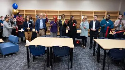 Wake Tech administrators and staff celebrate the opening of a library and tutoring space at the Beltline Education Center.