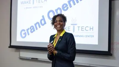 Wake Tech administrators and staff celebrate the opening of a library and tutoring space at the Beltline Education Center.
