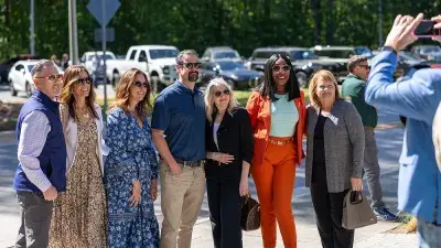Kellie J. Faulk looks at the sign in a Southern Wake Campus building that now bears her name.